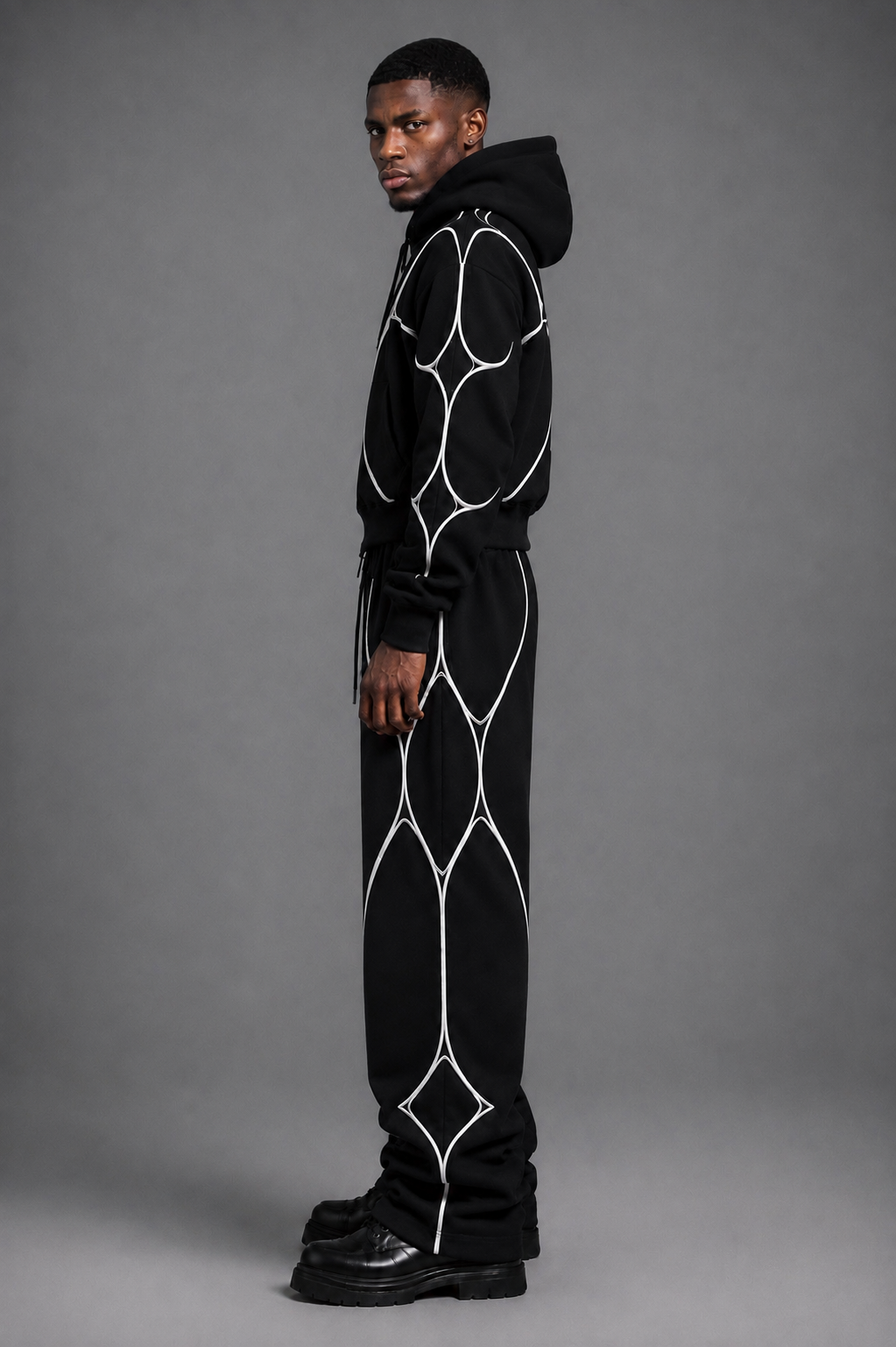 Close-up of the heavyweight matte black fabric and raised white textile piping.