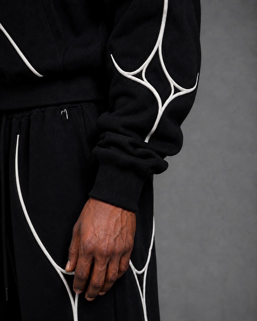 Pulse Hoodie V1.1 sleeve detail with white textile piping.