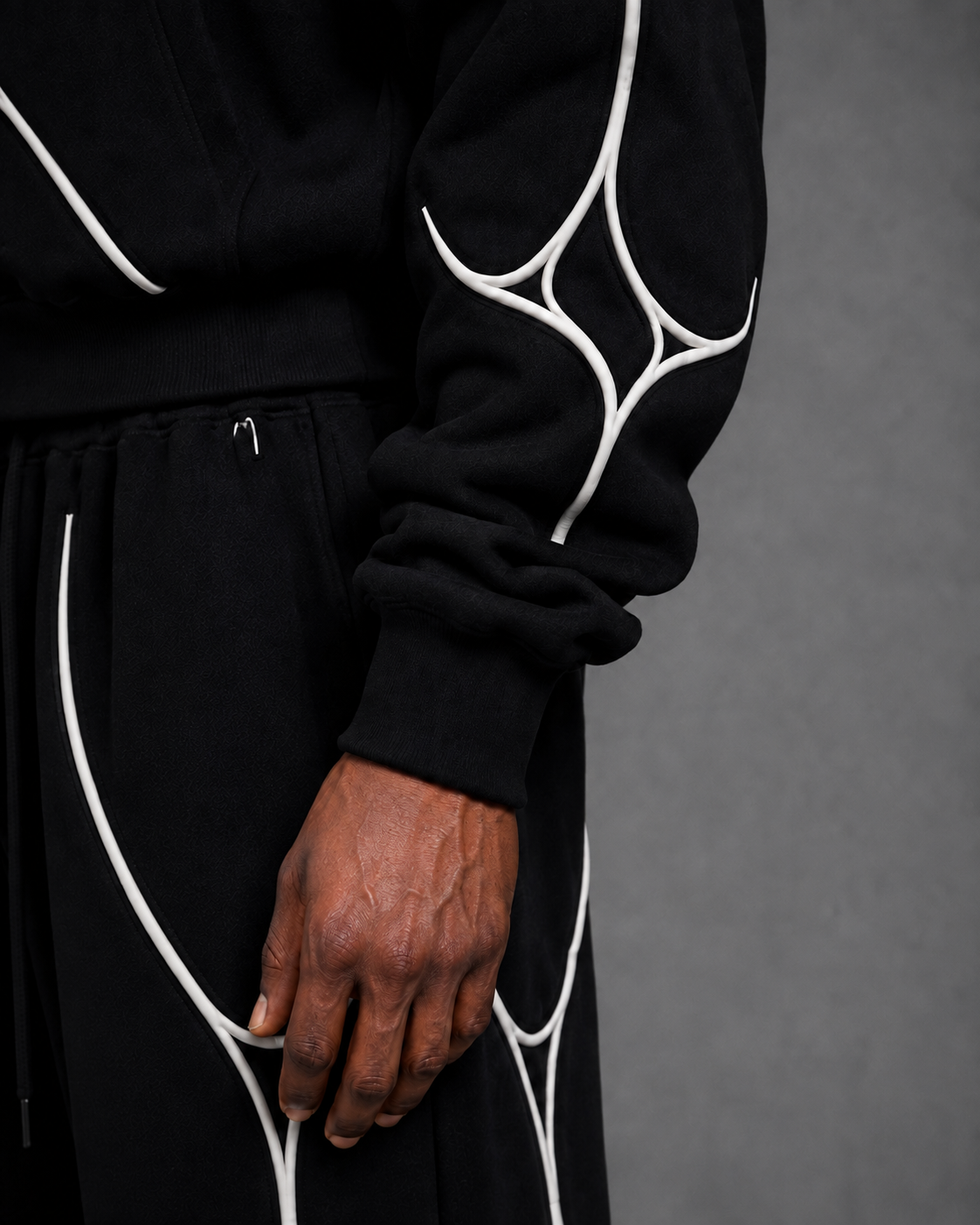 Pulse Hoodie V1.1 sleeve detail with white textile piping.