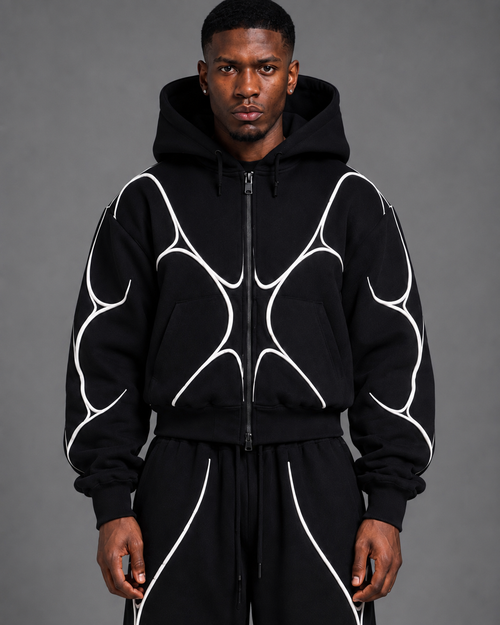 Pulse Hoodie V1.1 front studio view showing the cropped oversized silhouette and white textile piping.