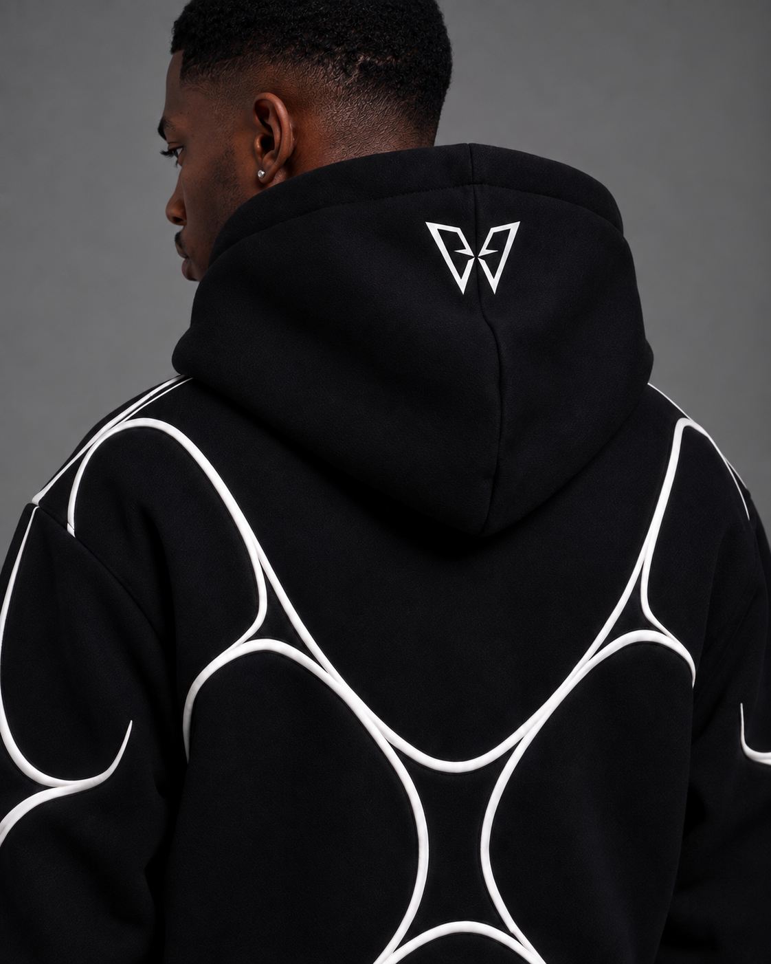 Pulse Hoodie V1.1 three-quarter back studio view showing the hood logo and rear piping.