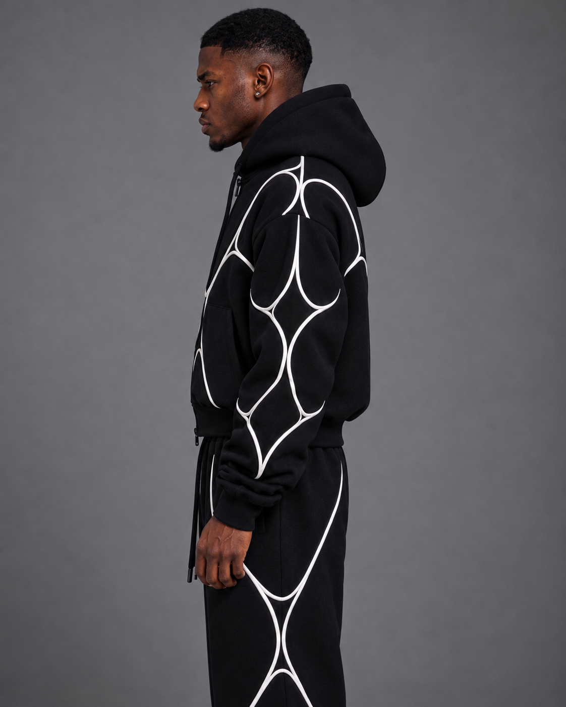 Pulse Hoodie V1.1 side profile studio view showing sleeve piping and volume.