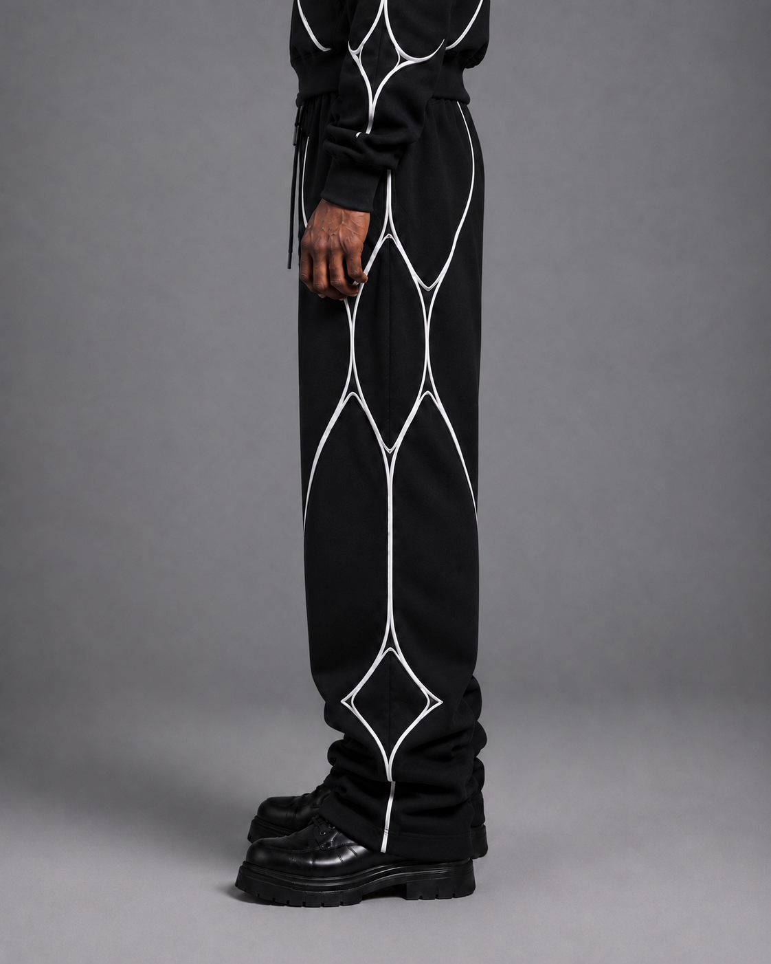 Pulse Wide-Leg Pants V1.1 front studio view showing the long wide-leg silhouette and white textile piping.