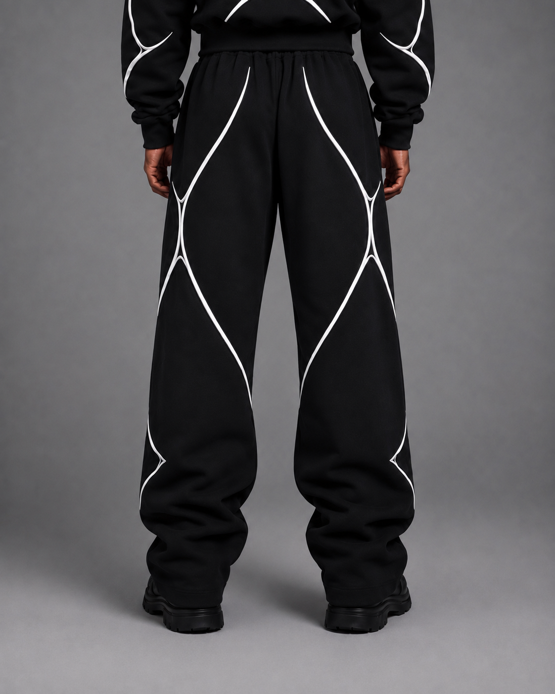 Pulse Wide-Leg Pants V1.1 back studio view showing the rear silhouette and piping.
